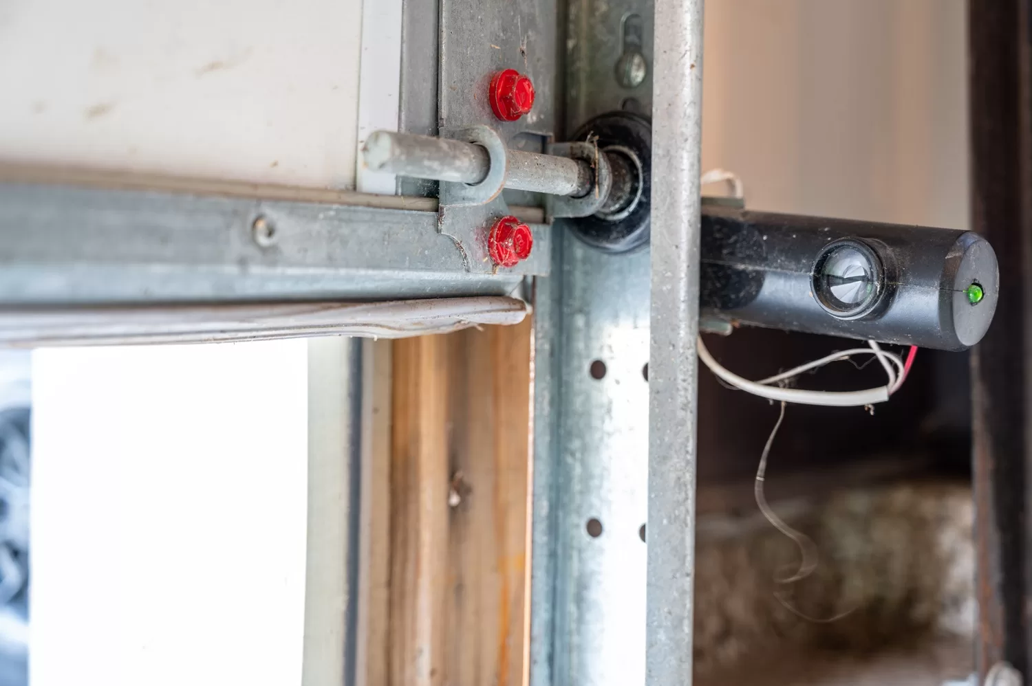 One,Receptor,Eye,Of,A,Garage,Door,Safety,Sensor,That How to Lubricate Your Garage Door