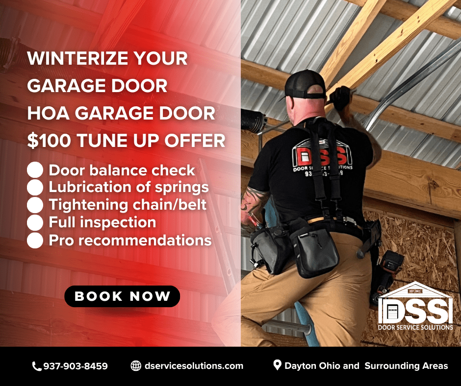 Garage door technician inspecting a residential garage door in Dayton Ohio